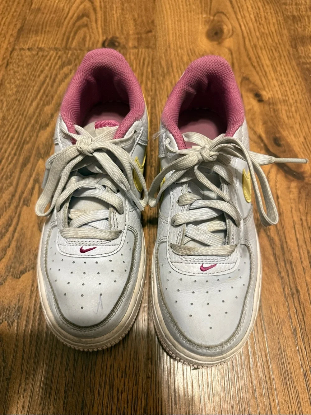 Nike Kids White Sneakers with Yellow Swoosh and Pink Lining